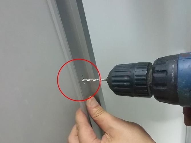 Drill Hole in silver Aluminum Door_1